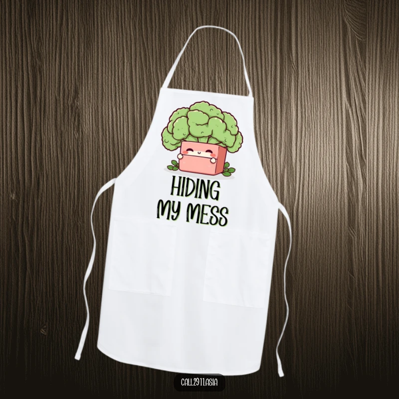 Funny bento box character peeking from behind a broccoli floret, printed on a practical and humorous kitchen apron.