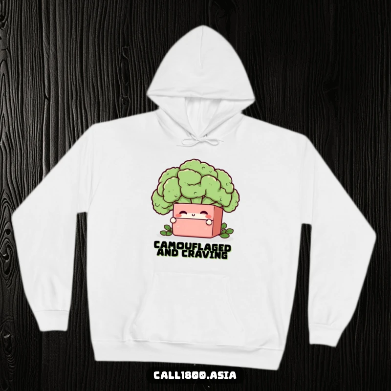 Funny bento box character peeking from behind a broccoli floret, featured on a soft and warm hoodie.