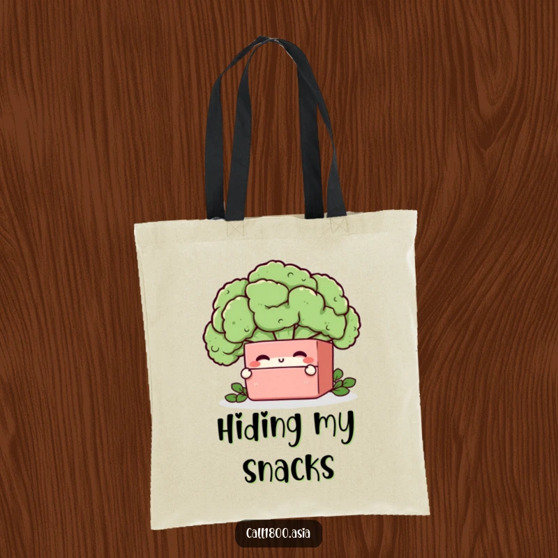 Funny bento box character winking from behind a broccoli floret on a durable and humorous tote bag.